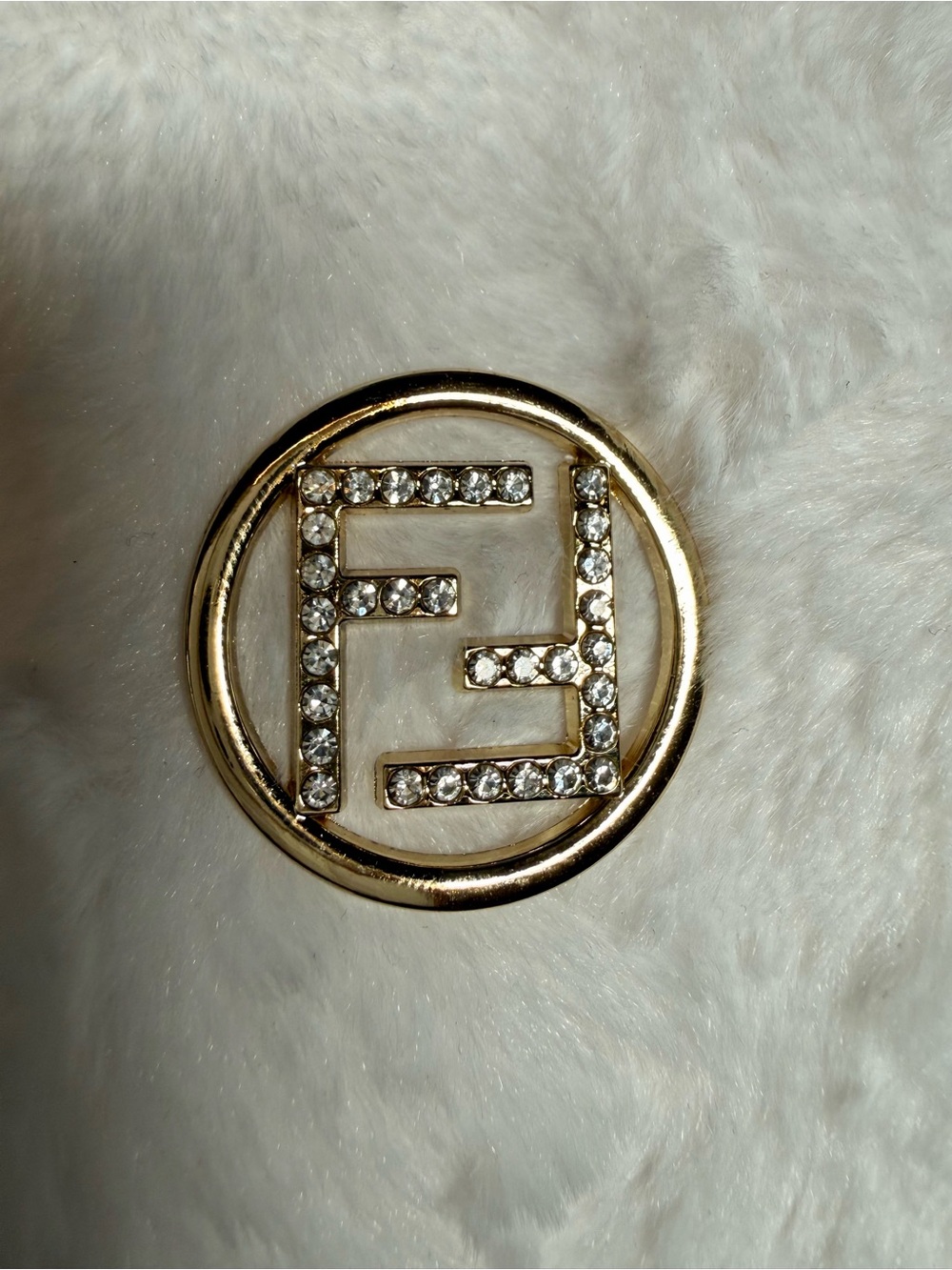Gold Tone Charm With Rhinestones and Chain Detail
